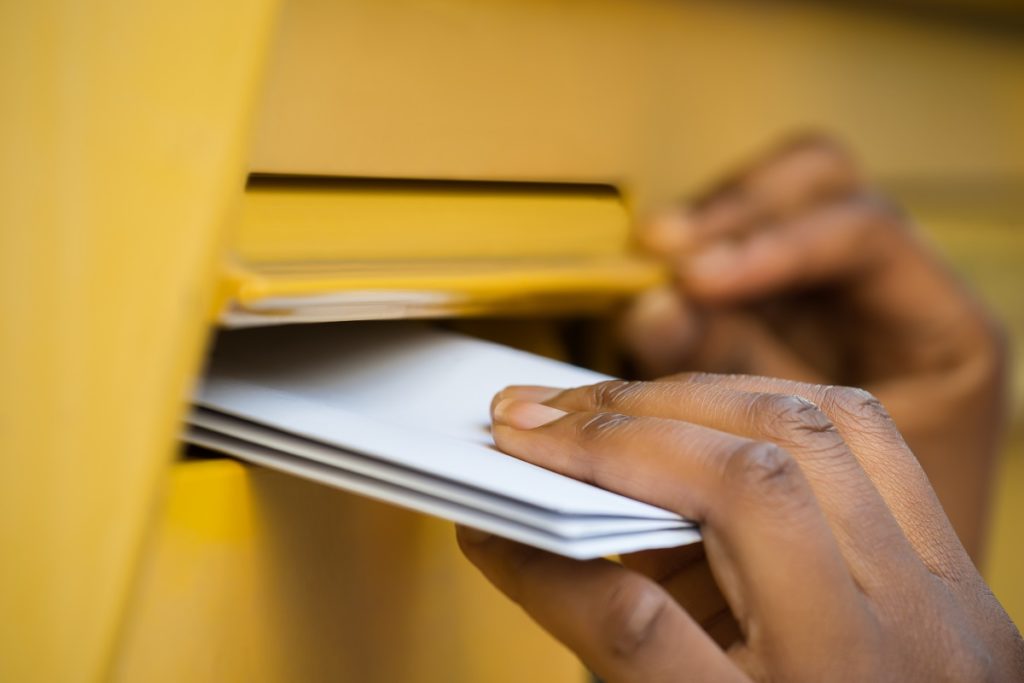 letters being put in the mail box
