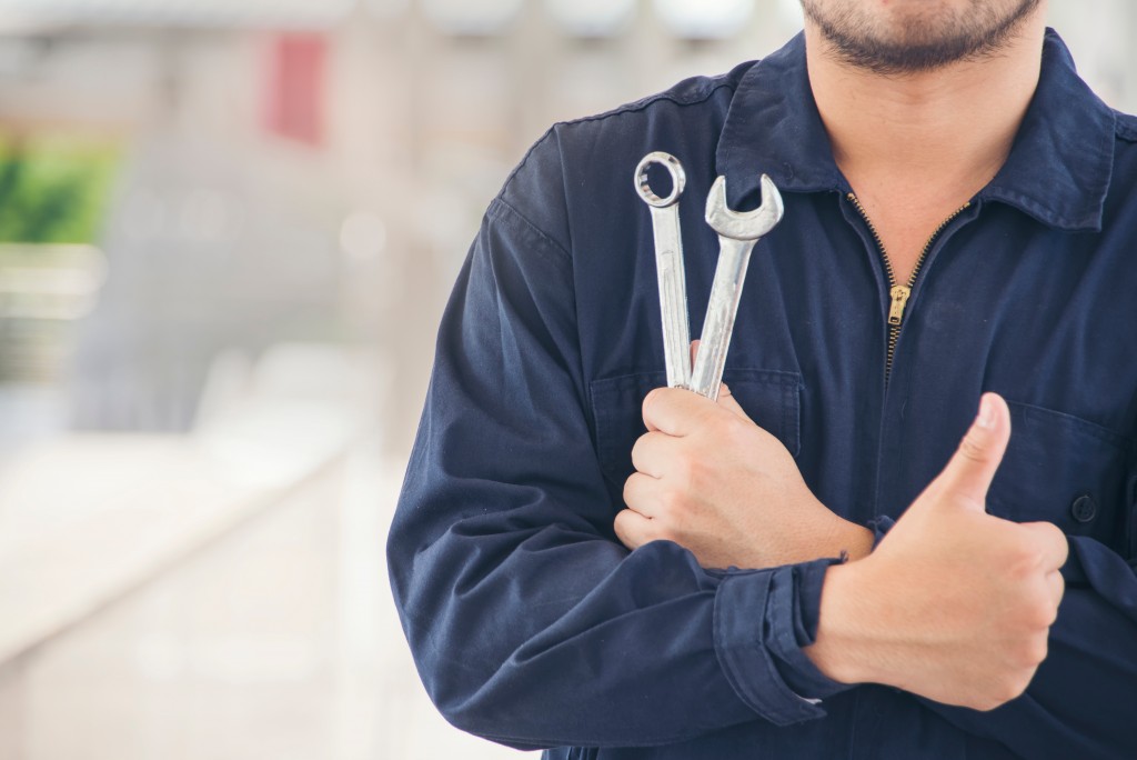 Man holding repair tools