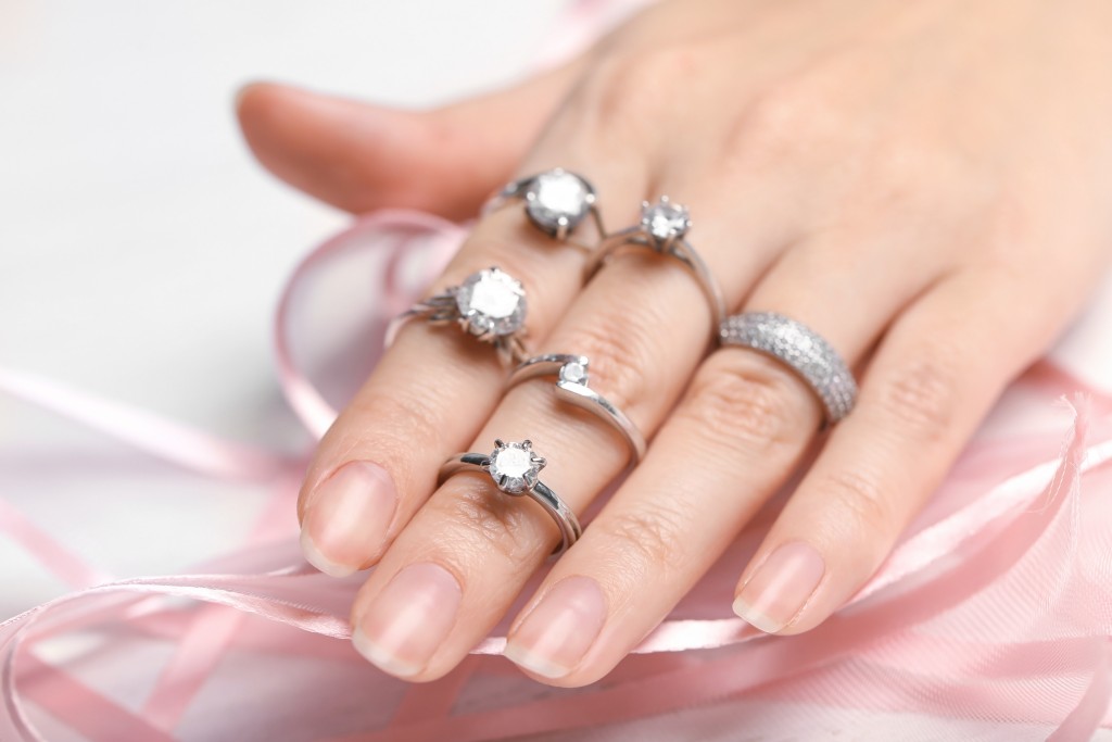 woman wearing rings